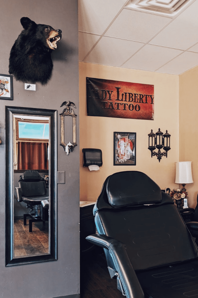 Inside our shop at Lady Liberty Tattoo - chairs designed for client comfort to make your experience feel great